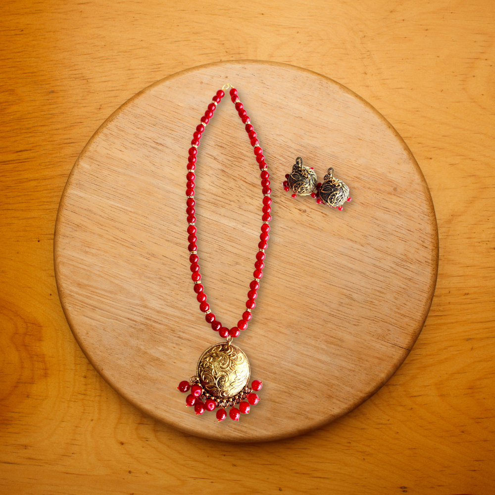 
                  
                    Vedaj Maroon Beads Antique Gold Necklace Set
                  
                